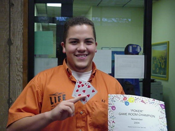 student with playing cards and winning certificate