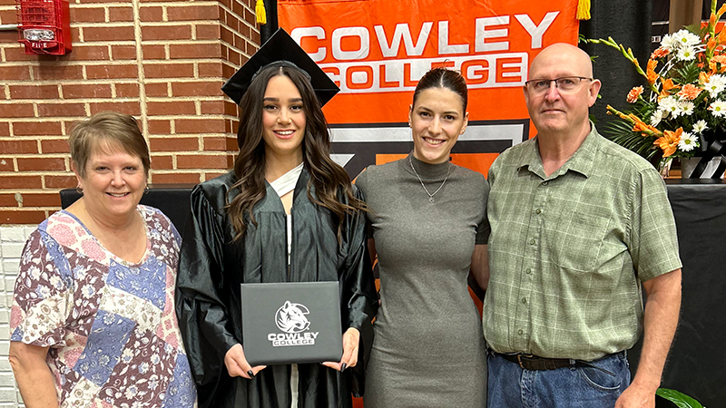 volleyball players at graduation with tiger foster parents