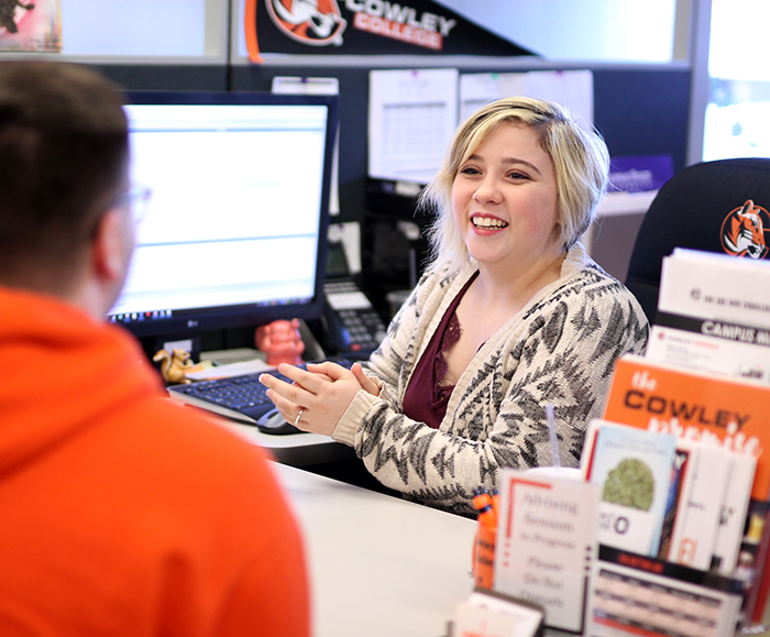 admissions staff enrolling a student