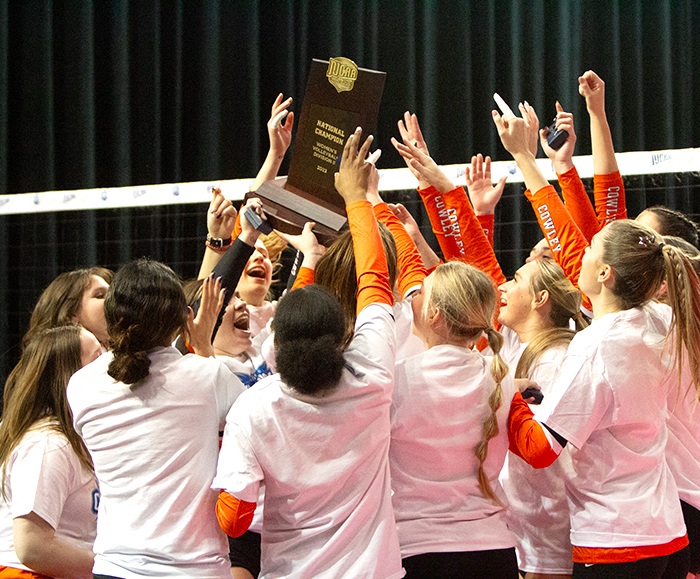 volleyball team celebrating national championship win