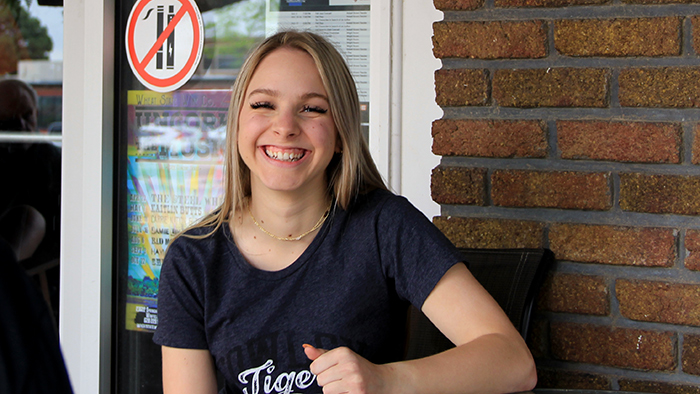 madi in front of steamy joes coffee shop