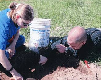 students at a dig site